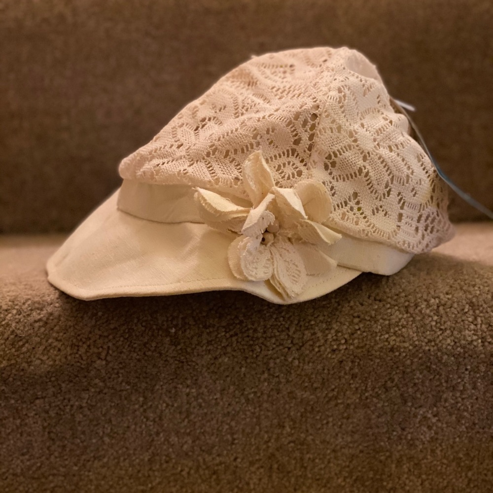 Lace, wide brimmed, sun-hat, with flower